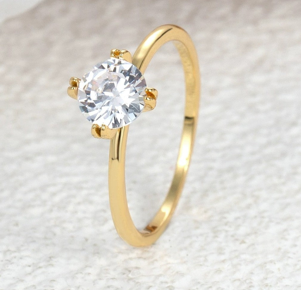 Minimalist Gold Solitaire Engagement Ring